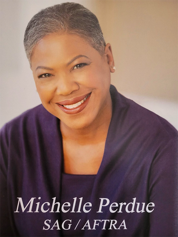 Headshot of Michelle Perdue, smiling, with SAG/AFTRA text overlay