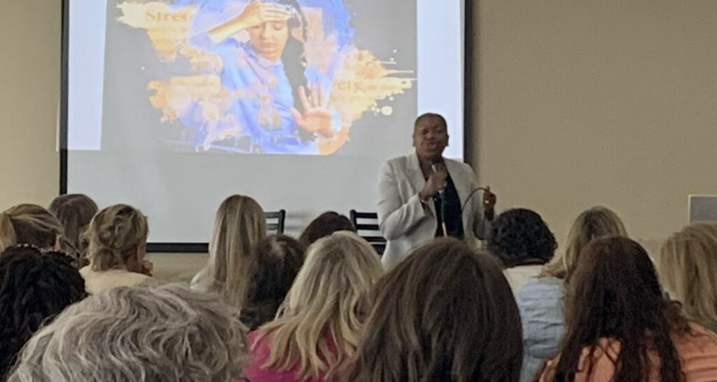 Michelle speaking to a group